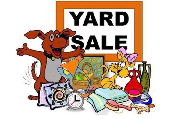 a yard sale sign with cartoon dogs and toys